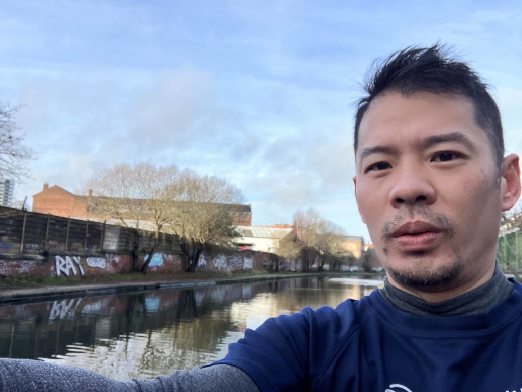 A selfie of Niki with a canal in the background.